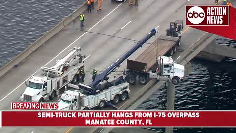 Semi-truck partially hangs from I-75 overpass in Manatee Co.