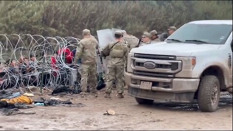 National Guard using riot shields & razor wire to block invaders at Eagle Pass, Texas