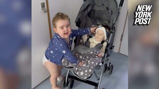 Toddler reunited with baby sister after cancer surgery
