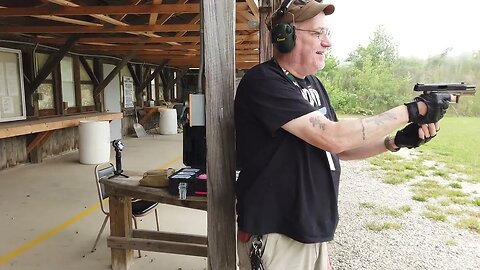 Me shooting a Sig at paper and steel