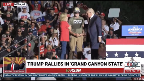 Donald Trump brings the parents of Kayla Mueller on stage at the rally in Arizona.