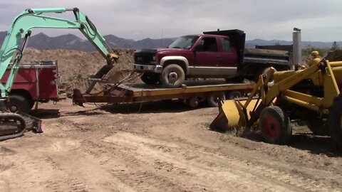 Loading Dump Truck On A Trailer