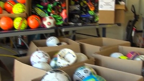 Teen gives soccer balls to kids in need