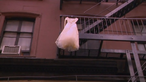 The Secret Reason Why There's a Wedding Dress Hanging from a NYC Fire Escape