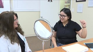 USF student receives hearing aids, hears out of ear for first time