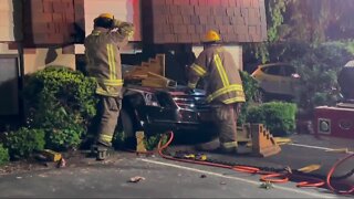 Woman killed after car crashed into apartment