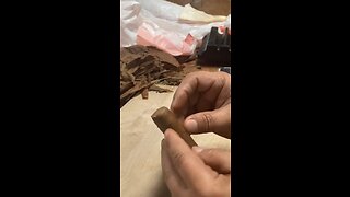 Rolando adds the second cap to his handrolled cigar at Bobalu Cigar Co