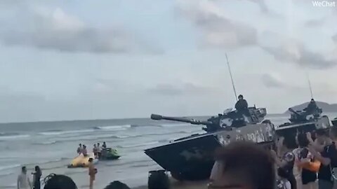 Chinese TANKS flood beaches opposite Taiwan as Beijing warns America will 'pay