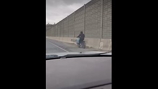 Cyclist On Highway 401