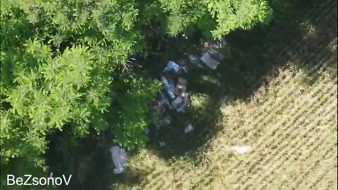 The DPR army drop grenades on a cache of Ukrainian weapons using a drone in the Ugledar region