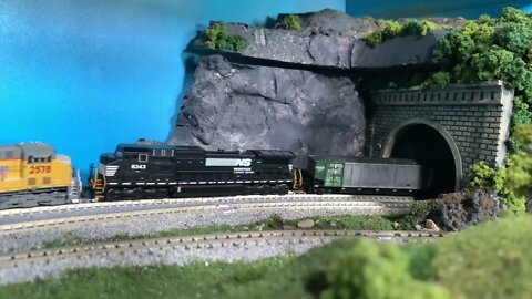 Heavy CSX/UP/NS coal train emerging from a tunnel