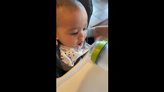 Cute baby drinking water