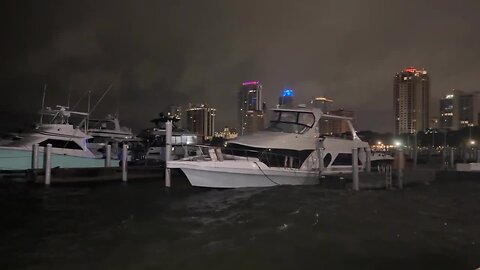 Boat, lightning, water over sea wall - across from Vinoy Hotel in St. Pete