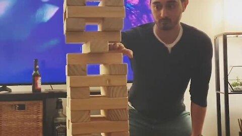 Guy successfully completes impossible Jenga move