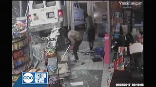 Surveillance video shows suspects crash stolen van into Sunoco gas station