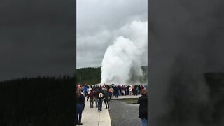 Old Faithful Geyser Eruption and the Crowd at Yellowstone National Park.