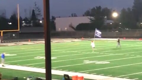 trespassed for running down the field with a Trump flag