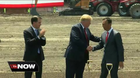 Residents passing by Foxconn site cautiously optimistic