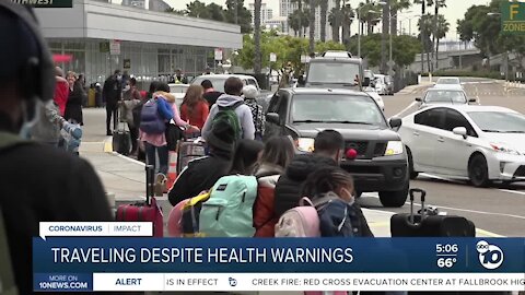 Millions travel for holiday weekend despite health warnings