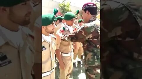 SSG Commando Decorating Parachute Wing in Officer's chest