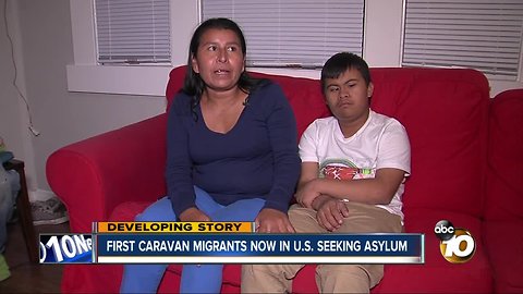 Members of migrant caravan cross legally into U.S. seeking asylum