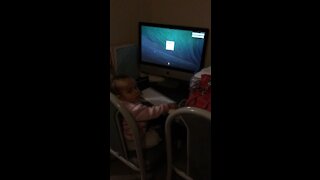 Baby learning to type on computer