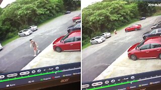 Guy doesn't park his car correctly, ends up chasing it across the parking lot