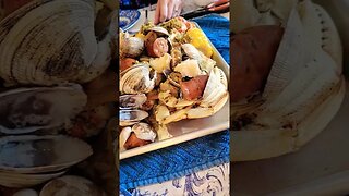 Dungeness Crab, Clams, Cod, Andouille Sausage, and Corn covered in Garlic Butter.