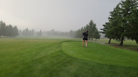 Cassi Golfing in the storm