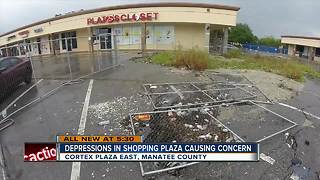 Customers frustrated over large holes in shopping plaza parking lot