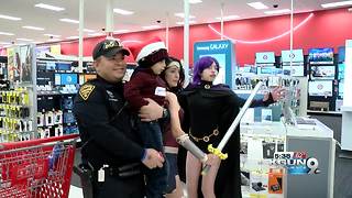 Police officers take kids shopping for toys