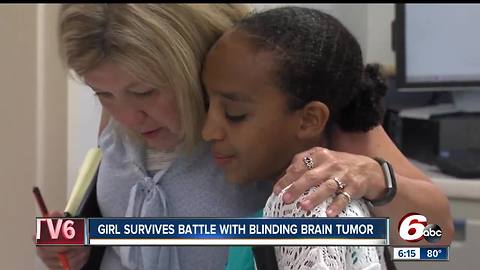 Girl survives battle with blinding brain tumor