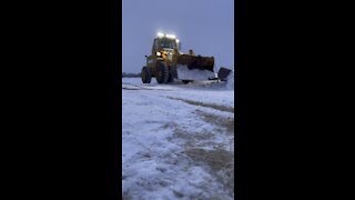 Plowing snow with a front end loader