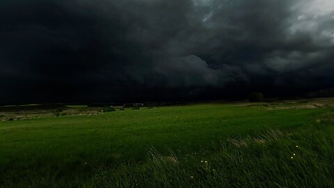 Dark Thunderstorm Approaches Over Valley