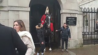 The kings guard uses horse to make tourist move