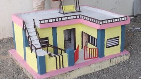 Building a miniature model of a dream house with cement.
