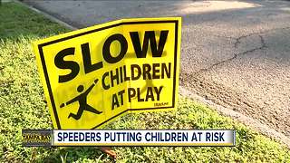 Tampa mom working to install 'slow down' sign