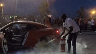 Occupants bail out of supercar as it catches on fire at charity event