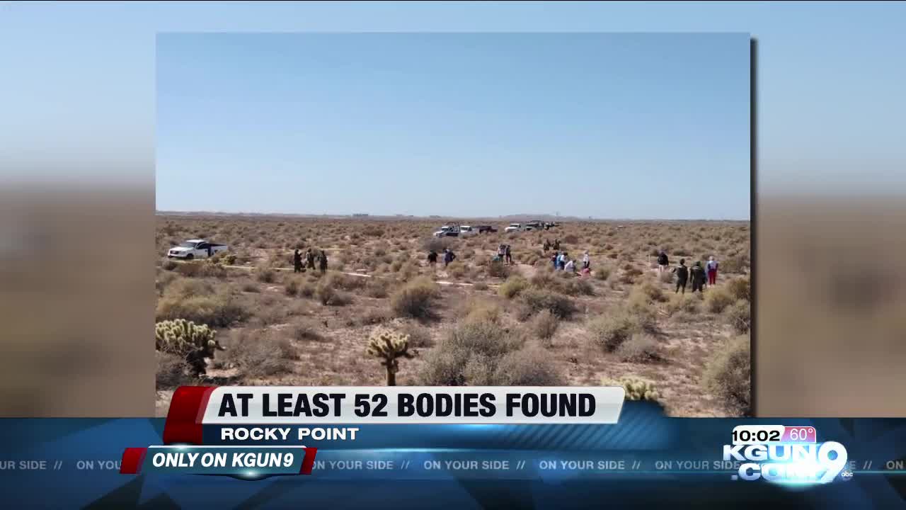 Search group who found 52 bodies say they were threatened at gunpoint