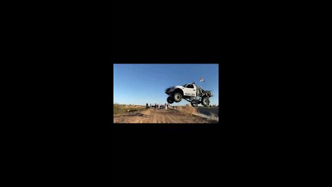 Truck attempts jump across canal.