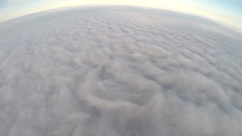 Jaw-dropping paragliding session over sea of clouds