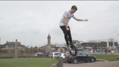 Young man pulls off impressive unicycle tricks