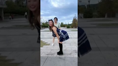 Two Crazy Chinese Girls Jumping Over Each Other