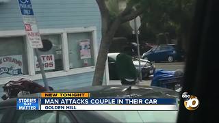 Man attacks couple in car