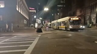 checking out the shuttle buses down on Boylston Street down by Copley