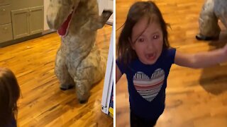 Little Girl Totally Frightened By Her Brother's Dinosaur Costume