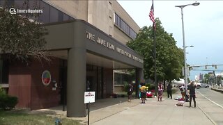 Demonstrators call for end to housing kids in county office building