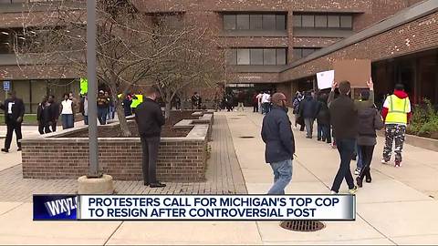 Protesters call for Michigan's top cop to resign after controversial post