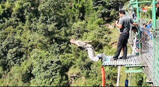 Foreigner enjoying bungee jumping