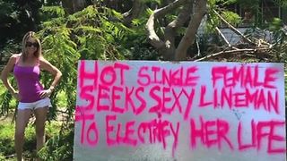 Woman makes sign to get power back on